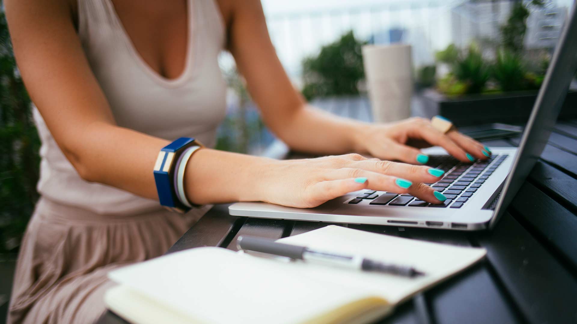 hands on a laptop