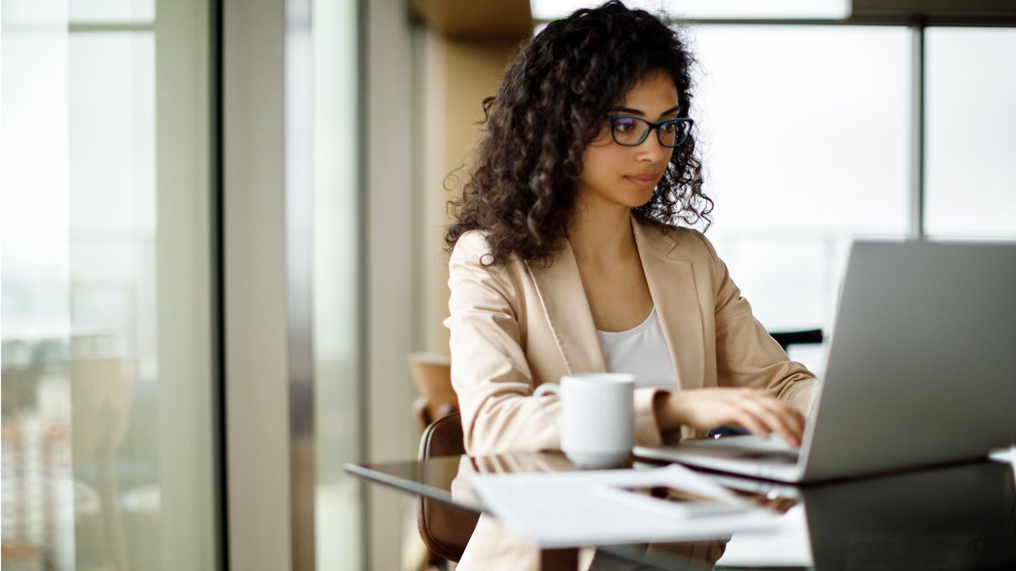 hispanic woman taking online course