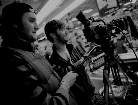 Two cinematographers using a camera
