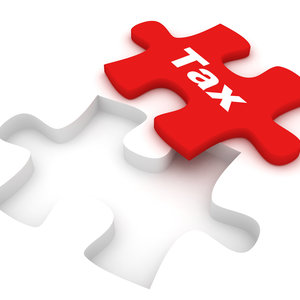 red puzzle piece with the word Tax on it