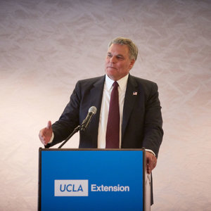Charles P. Rettig speaking from a podium
