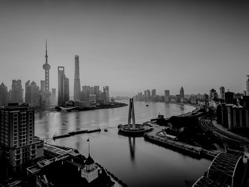Shanghai Pudong sunrise over a city and river.