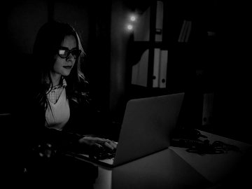 Woman programming on laptop