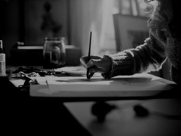 woman painting with watercolor