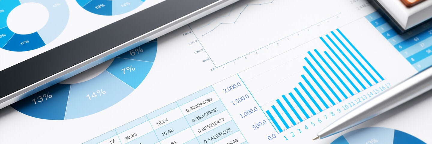3D business report and laptop on desk