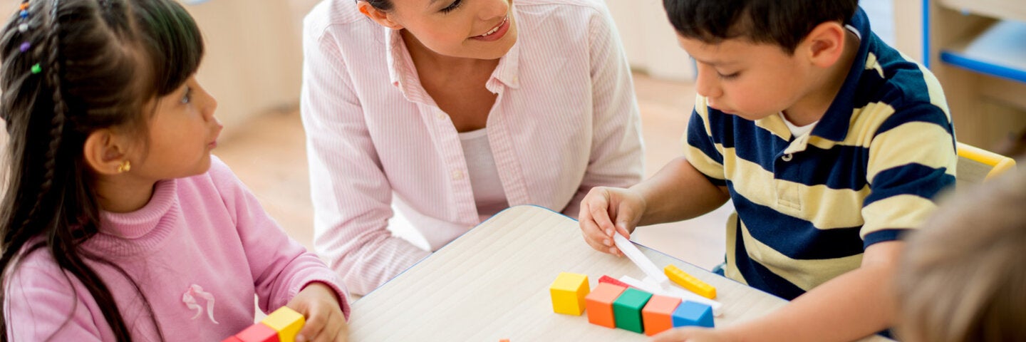 Teacher with two small children