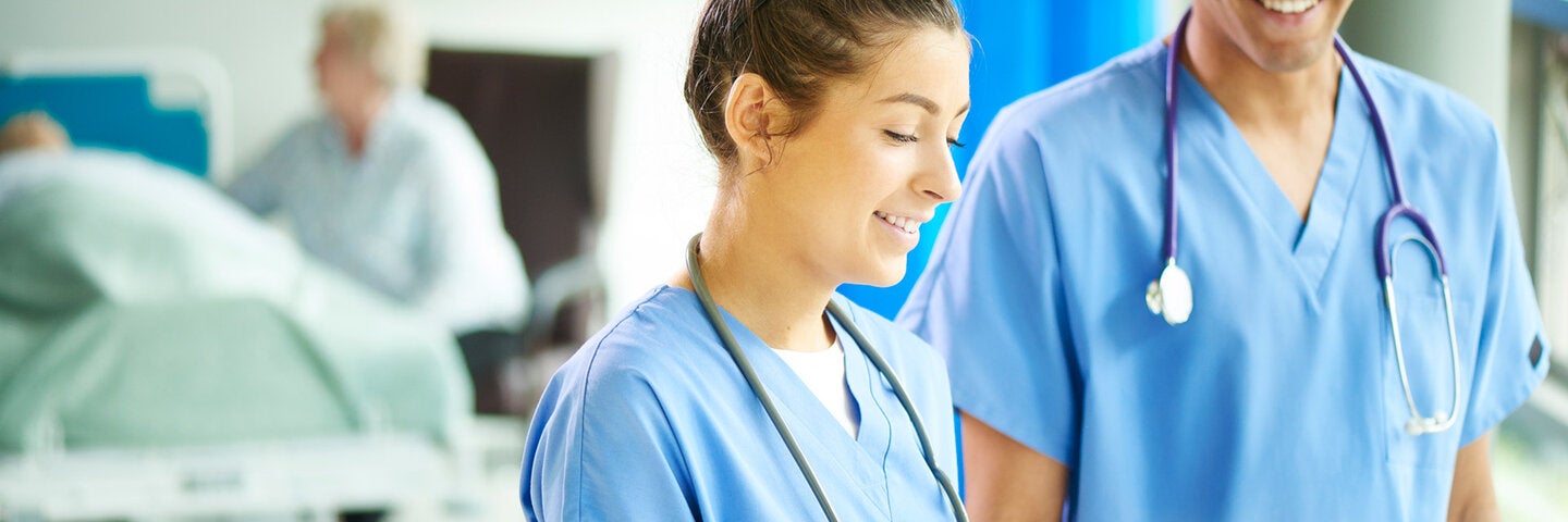 medical assistants looking at a chart