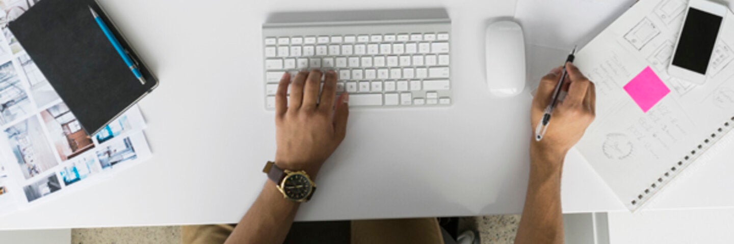 overhead view of someone on an apple computer