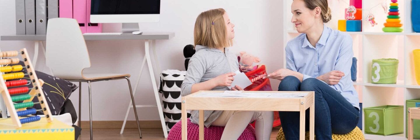 Teacher with young student