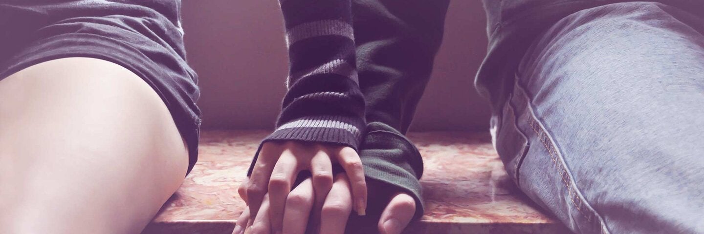 hand holding on top another