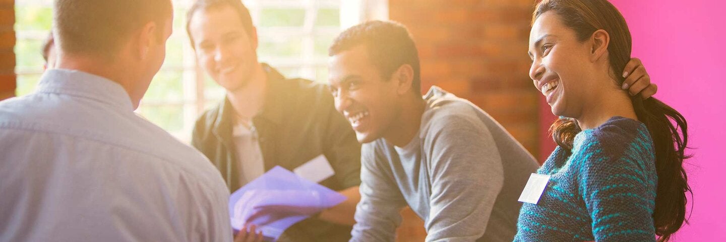 Smiling woman enjoying group therapy session