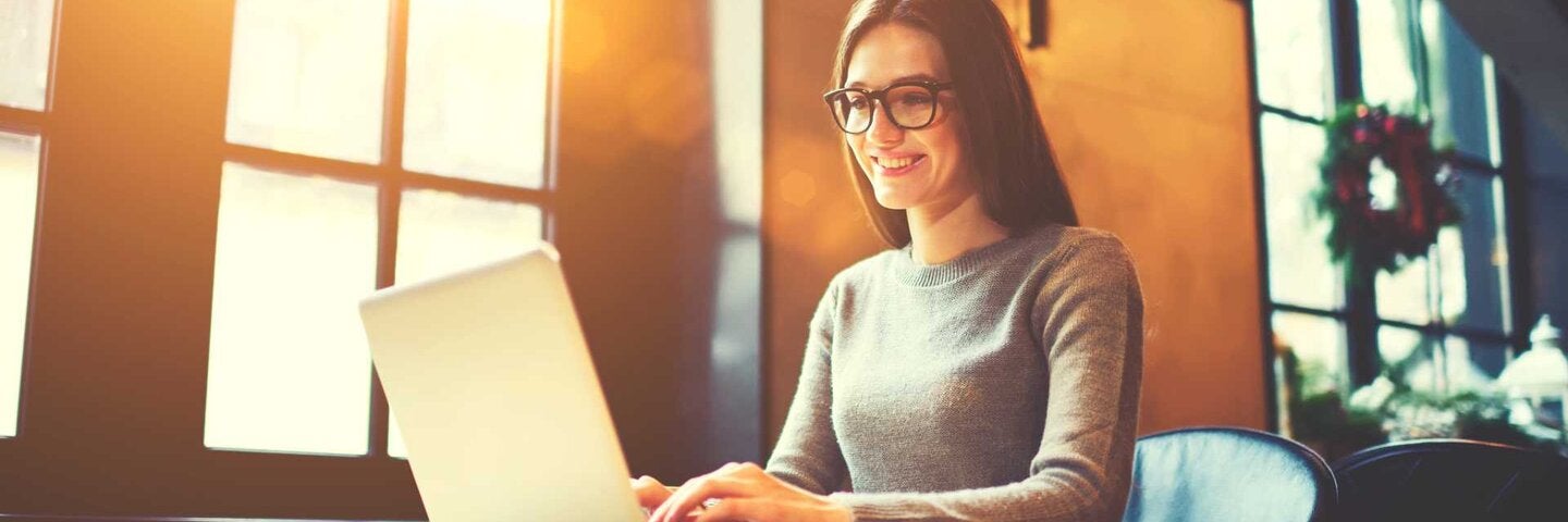 woman sitting with laptop