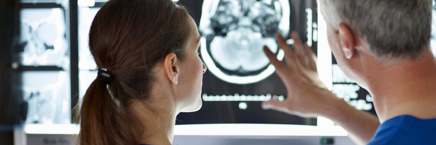 Radiologists looking at brain scans