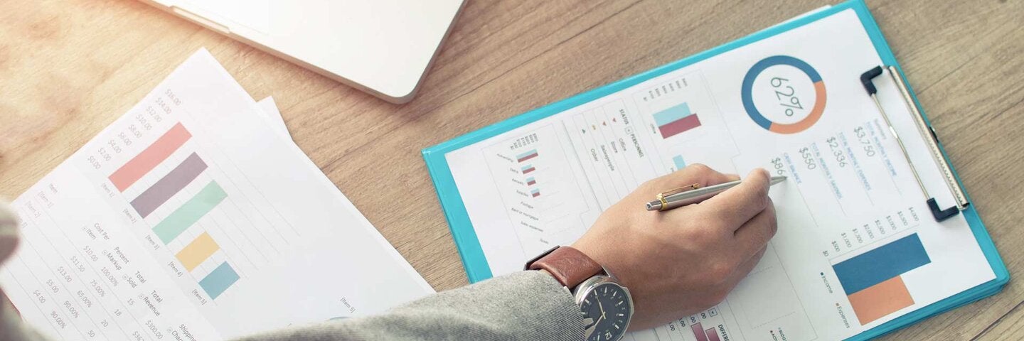 Businessman analyzing investment charts.