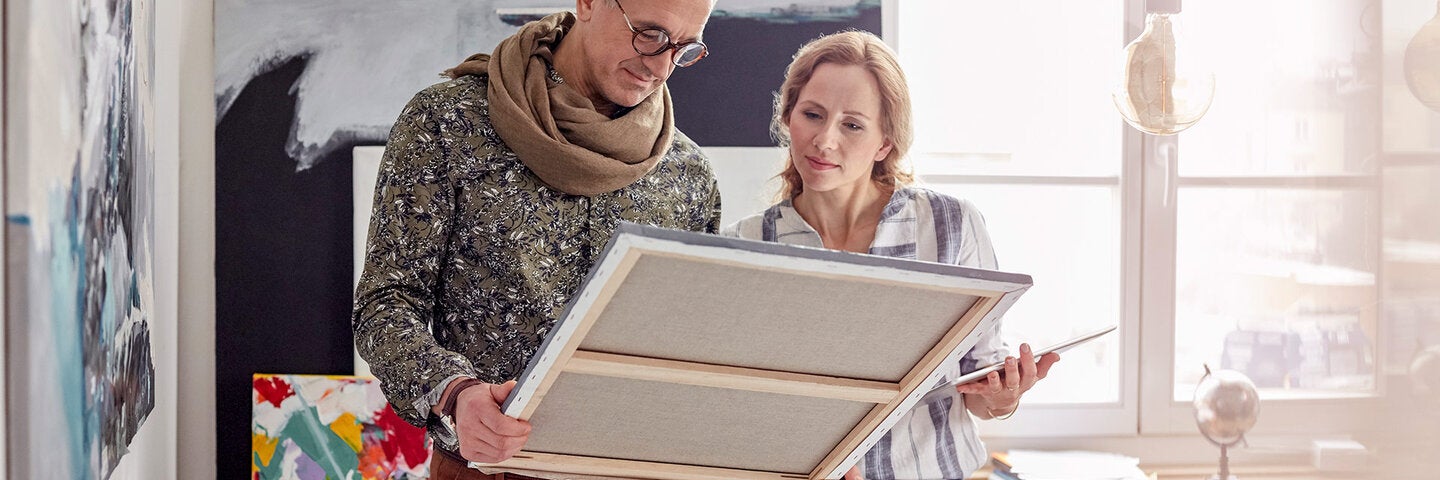 art enthusiasts looking at a painting