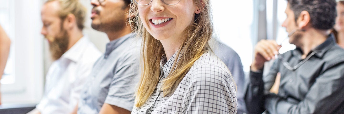 Smiling woman in writing class