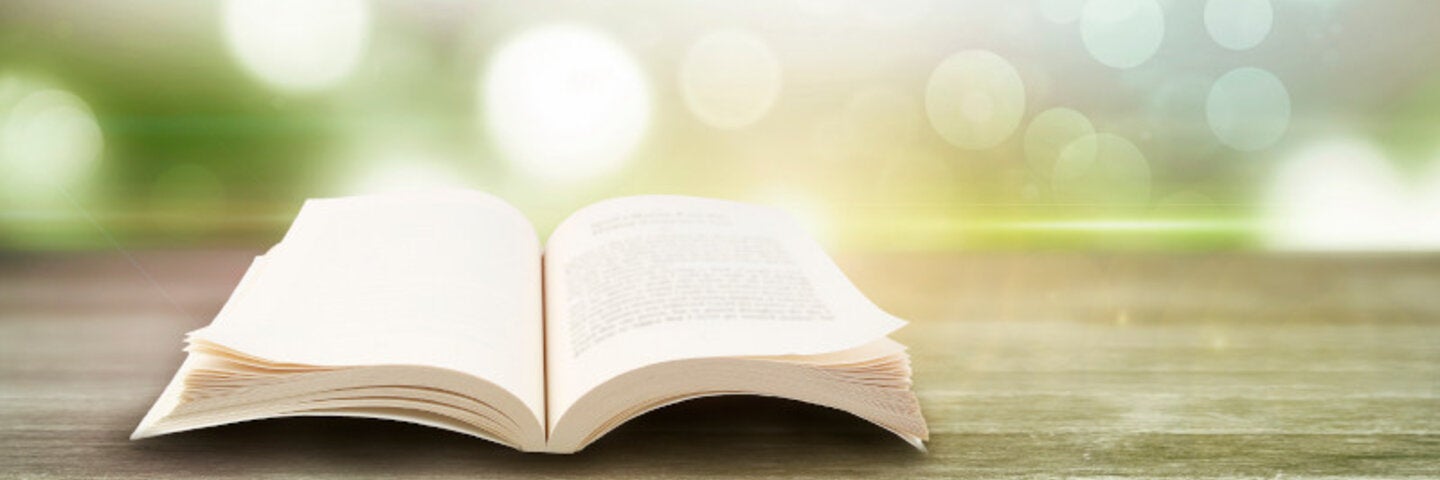 Decorative image: open book on a wooden table