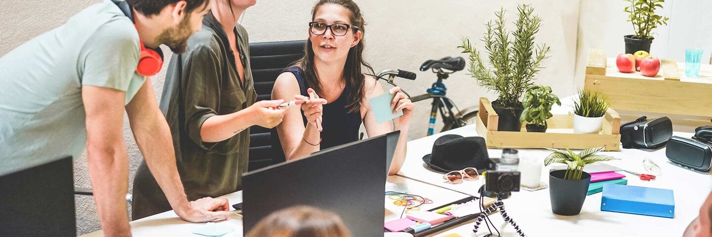 male and female co-workers in meeting