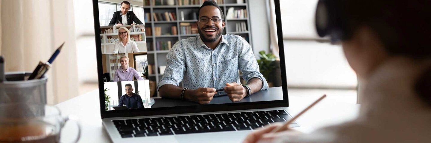 Woman on a remote classroom meeting on laptop.