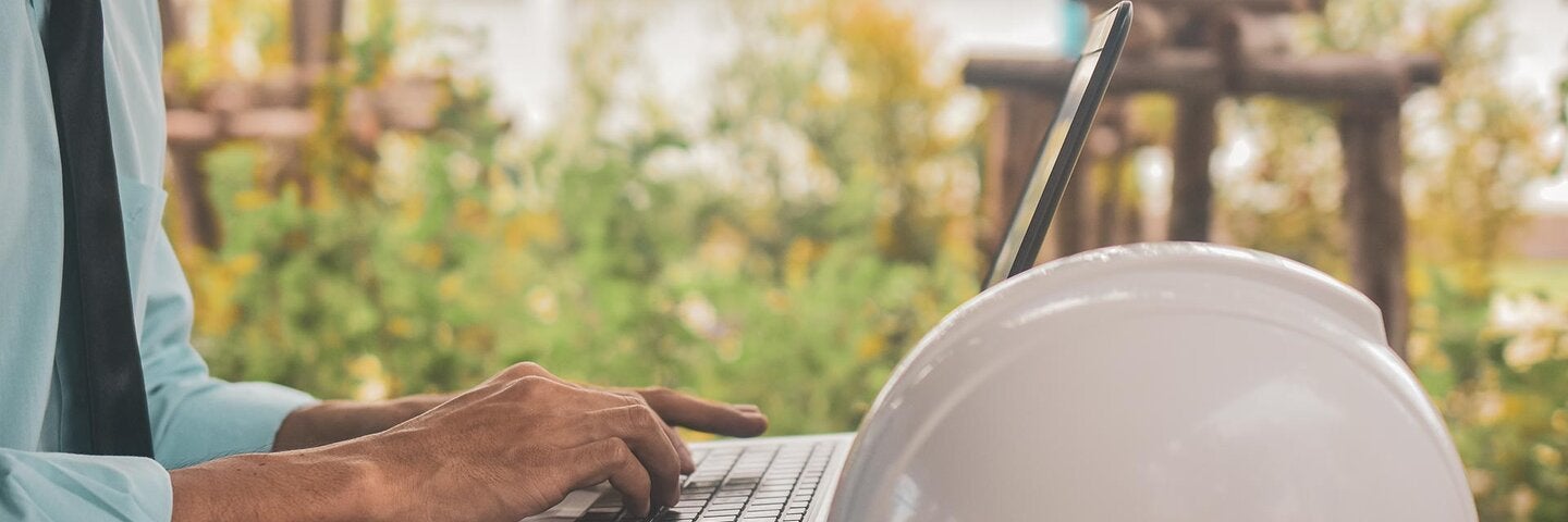 Construction worker on laptop