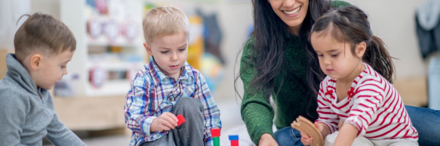 teach building structures on the floor with four young children