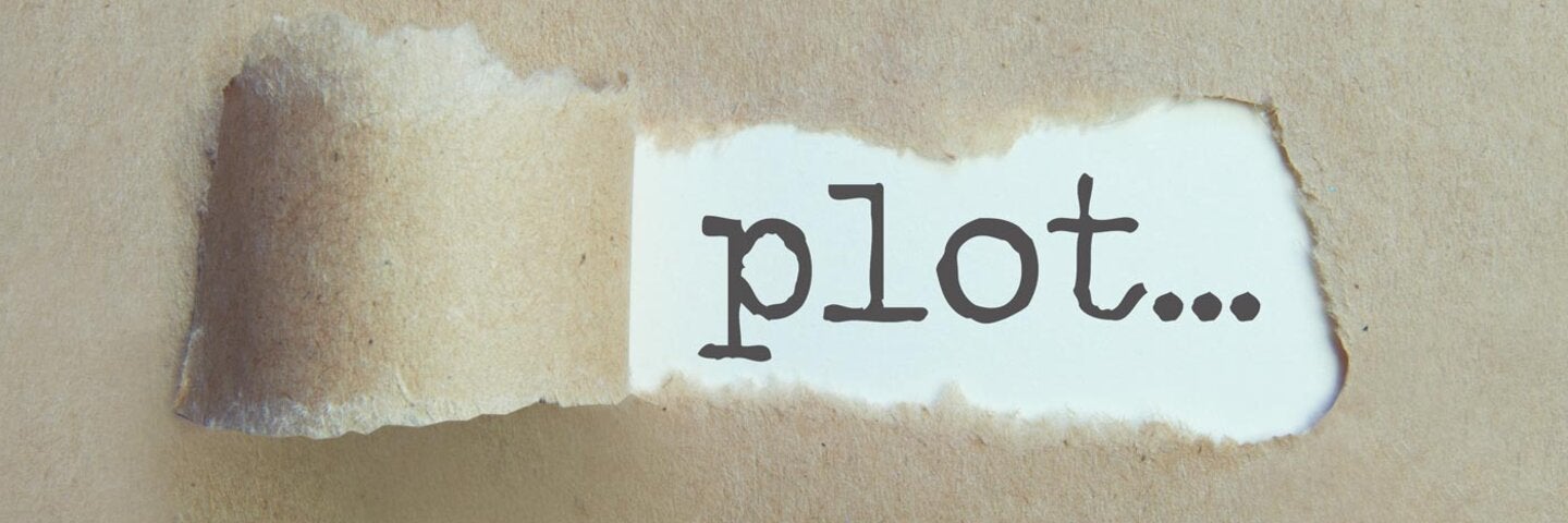 craft-paper-peeled-up-revealing-word-plot-on-paper