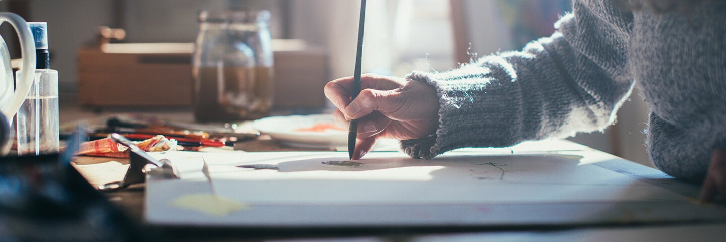 woman painting with watercolor