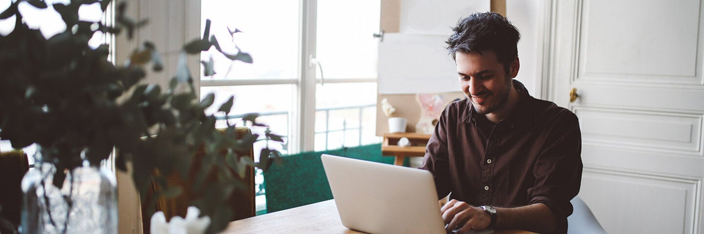 writer working at his kitchen table