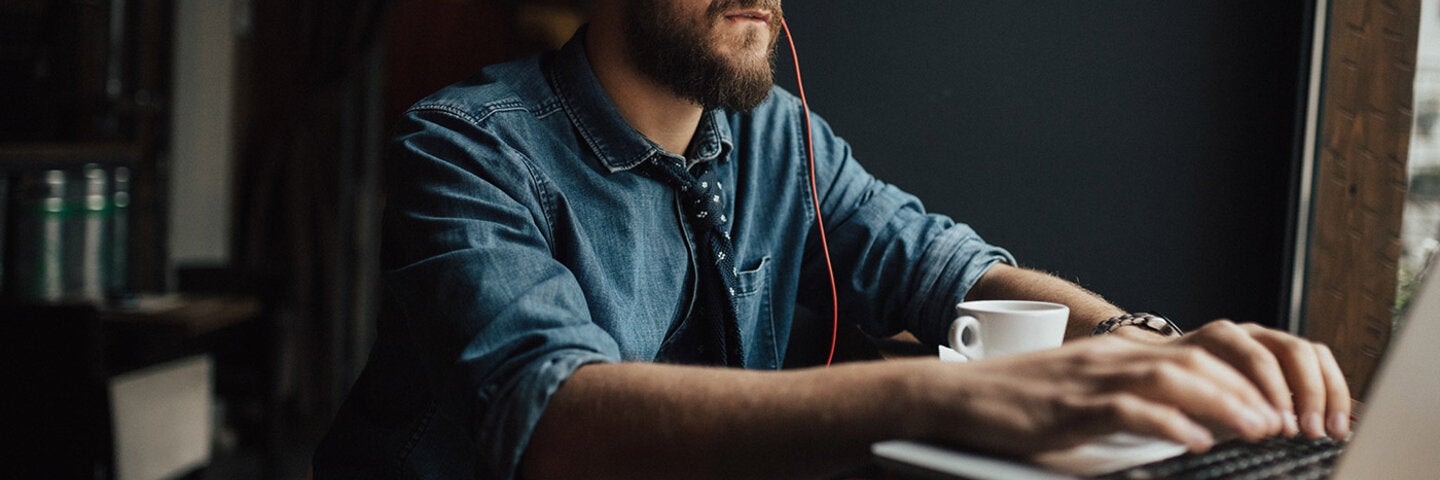 writer working on his laptop