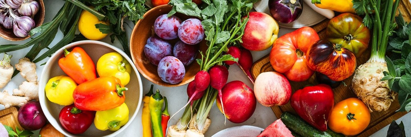 Fresh homegrown vegetables and fruits on kitchen table