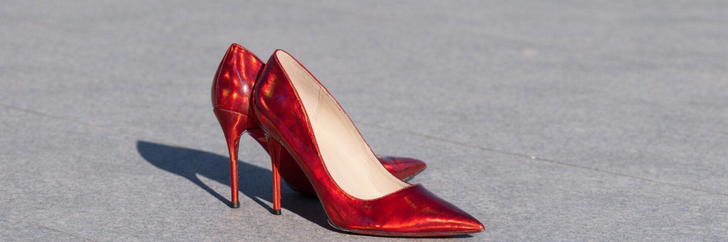 Red high heels on floor