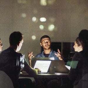 Group of people discussing digital technology