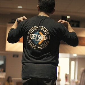 Get Safe logo on the back of a t-shirt worn by a Get Safe Instructor
