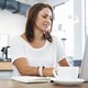 Editor reviewing notes on her laptop